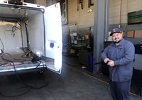 Joel running cables for the van refrigeration installation