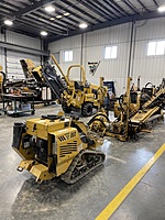 Many pieces of equipment we currently have pulled into our shop, showing the variety of Vermeer equipment we sell and service at our Olathe location.