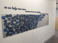 As we help each other, people will have the freedom to accomplish their dreams. This wall represents clients, donors, students, and friends. 