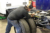David measuring in preparation for mounting the body onto the chassis