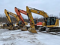 A few of our excavators and dozers lined up during the offseason.