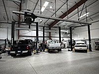 Epoxy flooring throughout. High end Challenger lifts. Exhaust system for tailpipes. Bright lighting. 