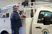 José doing service work on a customer's truck