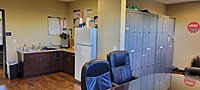 Breakroom with commercial coffee maker, refrigerator, microwave, toaster oven and sink. All employees get a locker and uniforms. 
