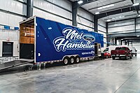 Track support racing trailer in warehouse