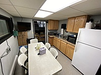 I believe the term that realtors would use to describe the breakroom is "cozy".  It's not huge, but it's effective!  
