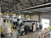 12 work bays with overhead cranes and three sets of mobile column lifts