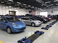 Our hybrid and electric vehicle training fleet in our customer shop.