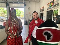 Owiti, certified Master Diagnostic Tech, dressed in his native country’s attire for a church event; but first had to show off and stopped at the store. 