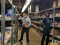Career Center teachers "shopping" for supplies to help their students along the path to an automotive career. This storage area is provided to the schools in one of our dealerships.  Our employees assist with receiving, storing, and shipping.