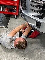 Porsche and Audi techs working together.