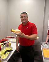 Javier Mendoza - Service Manager enjoying a burger and hot dog! 