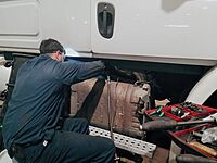Technician working on a truck in the shop