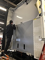 BODY SHOP TECHNICIAN ANDREW COLLINS INSTALLING BACK AND SIDE SLEEPER PANEL ON ACCIDENT DAMAGE TRACTOR