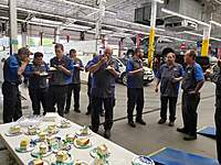 Celebrating our Technician's retirements with cake in our Ford Shop (facing Northeast)!