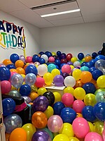 This is what happens here when you try to keep your birthday a secret. You find your office filled with 600 balloons.