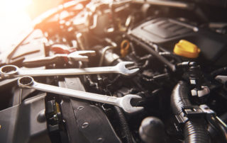 Tools in the engine bay of a car