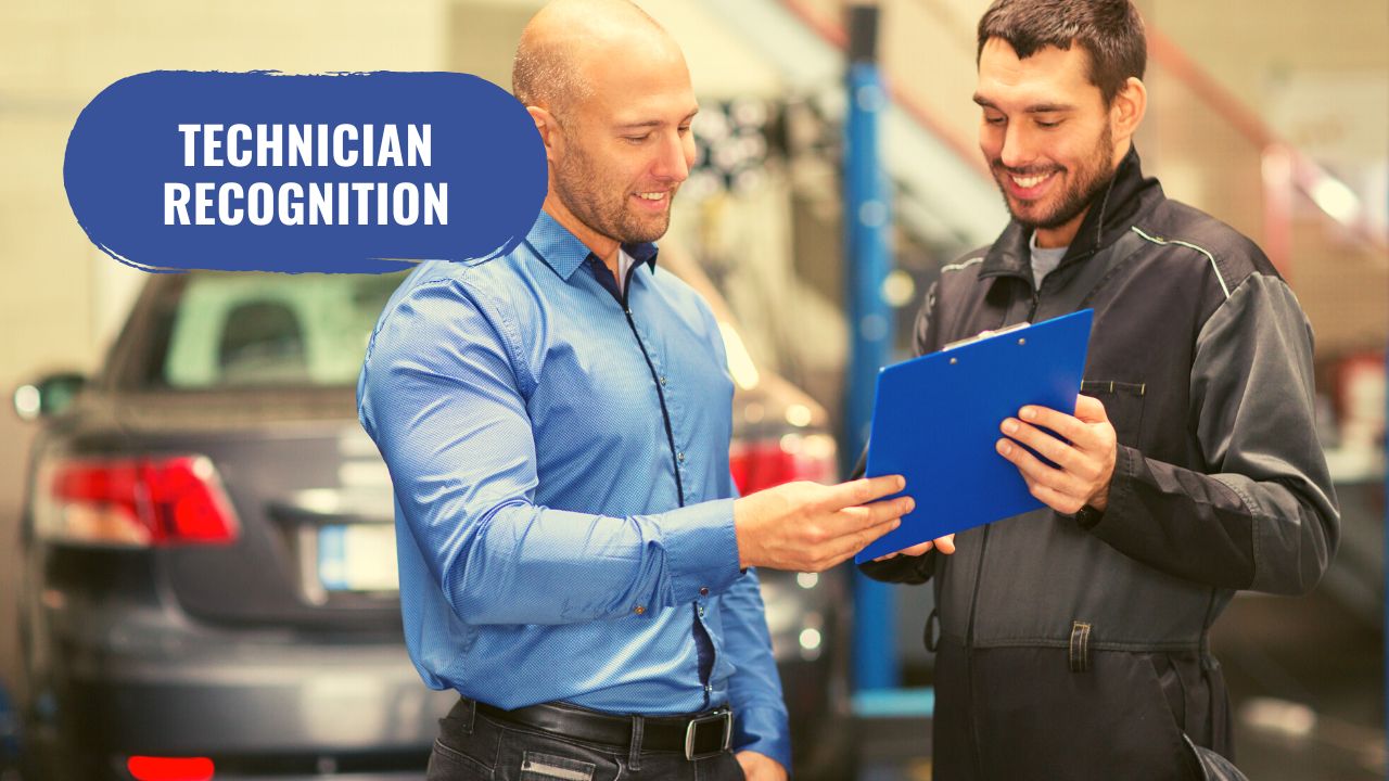 manager recognizing a technician in a repair shop
