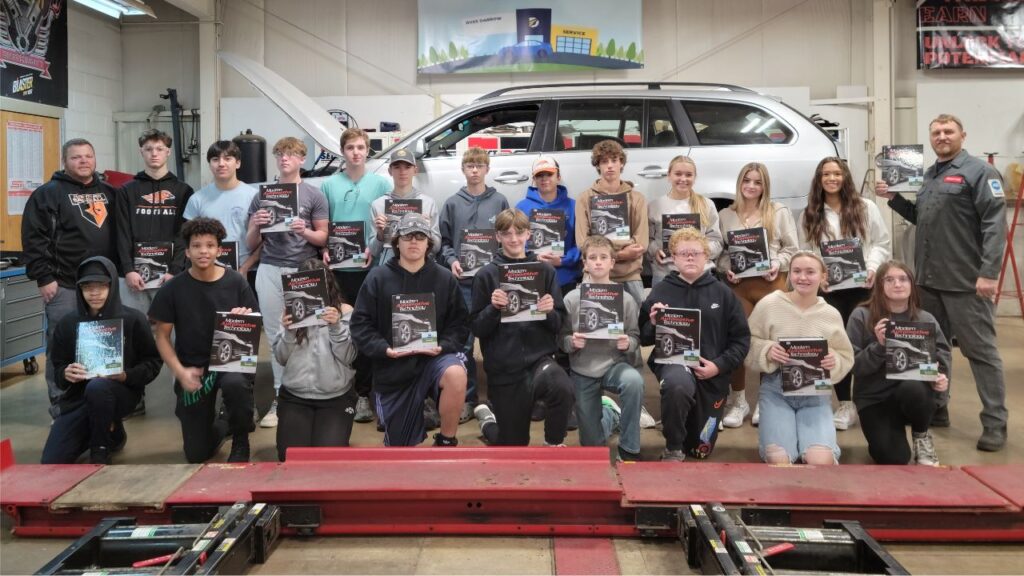 high school auto class with textbooks that were donated with the help of a local shop