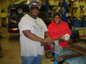 High school automotive students in shop