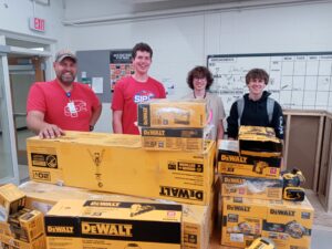 High school students with tools purchased from donation money