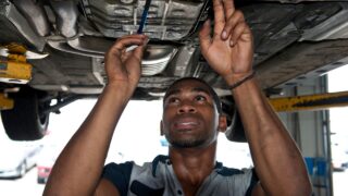 automotive technician working on a car