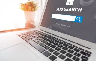 laptop with job search on screen