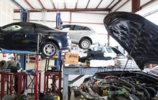 Cars on lifts at an automotive shop